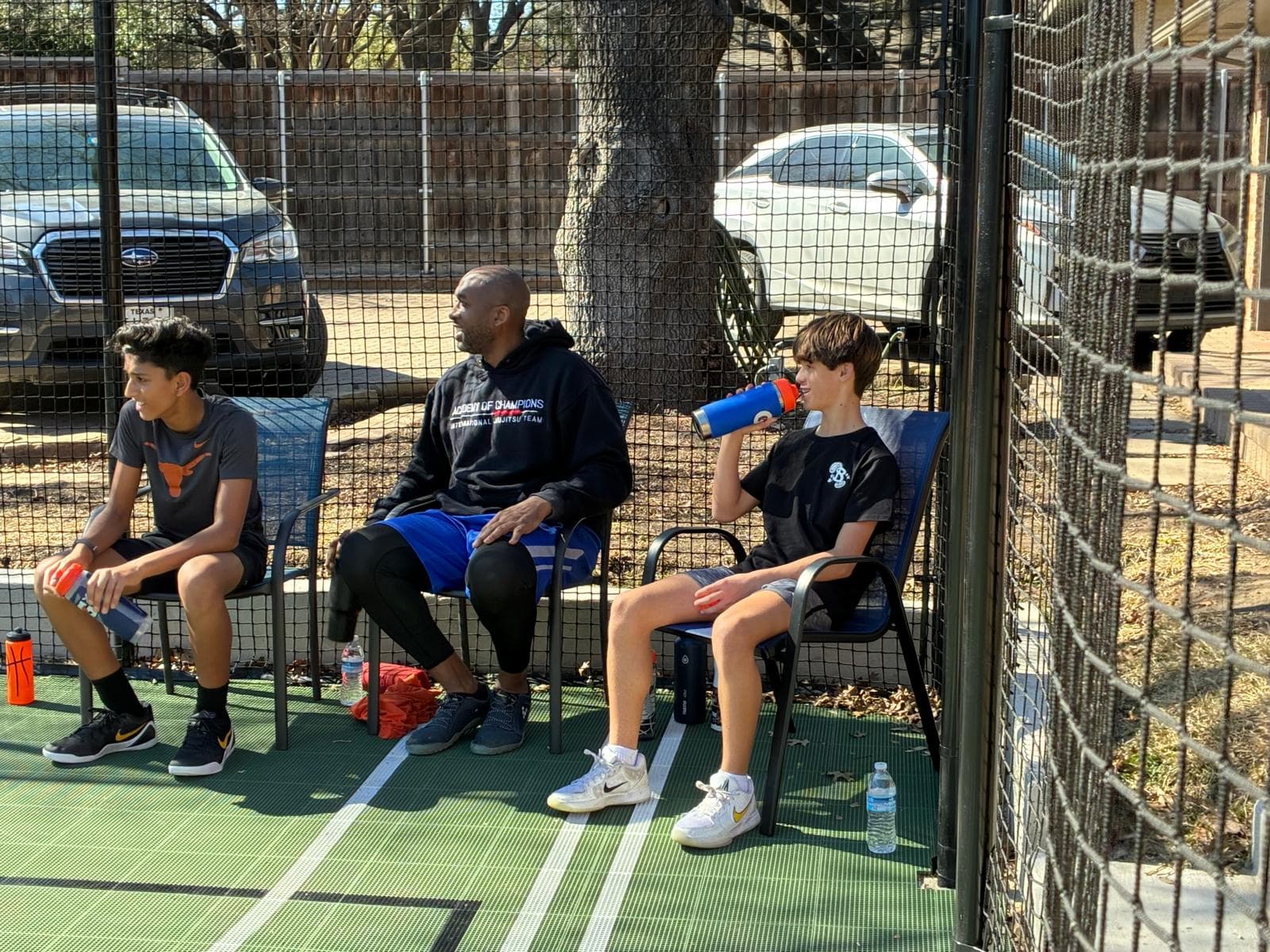 Coach T with players on his home court